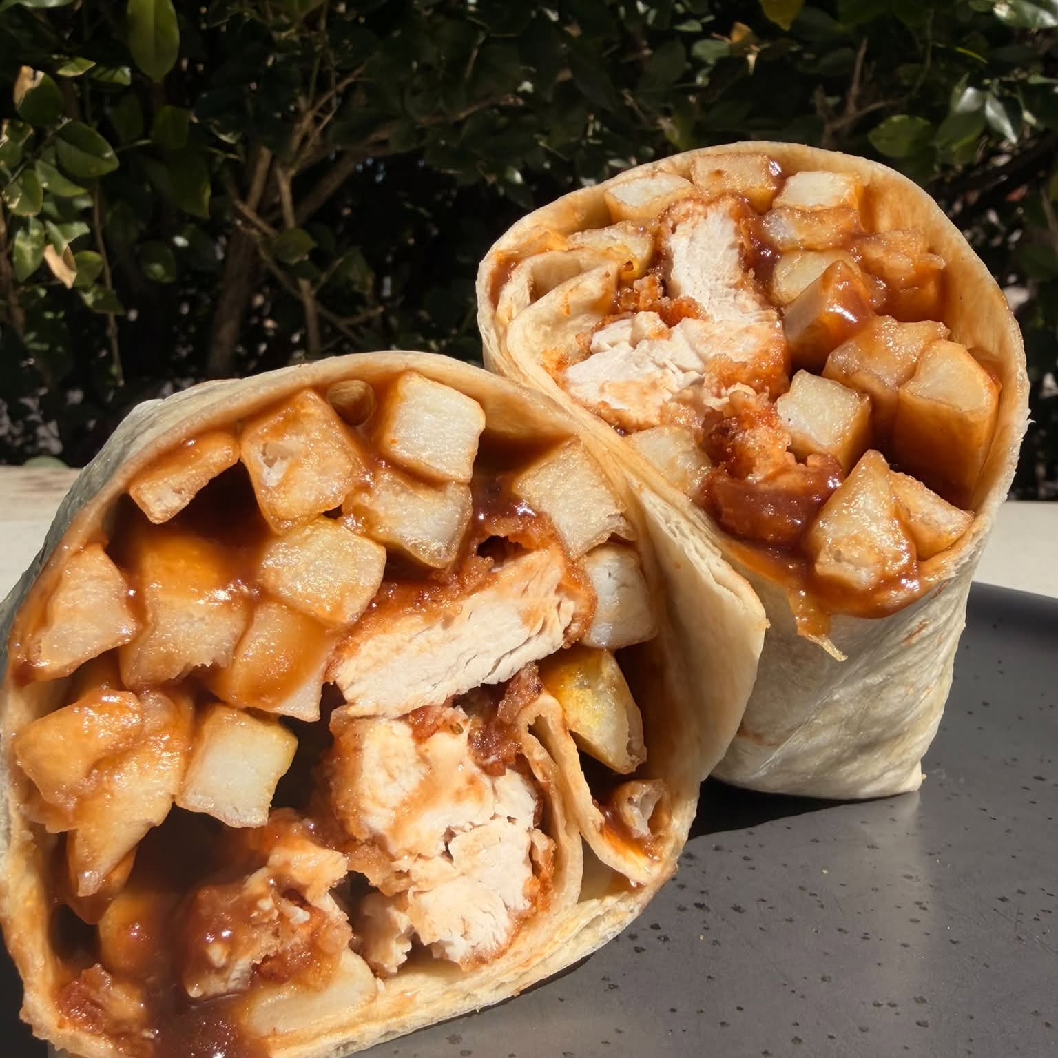 Chicken, chips and gravy wrap cut in half