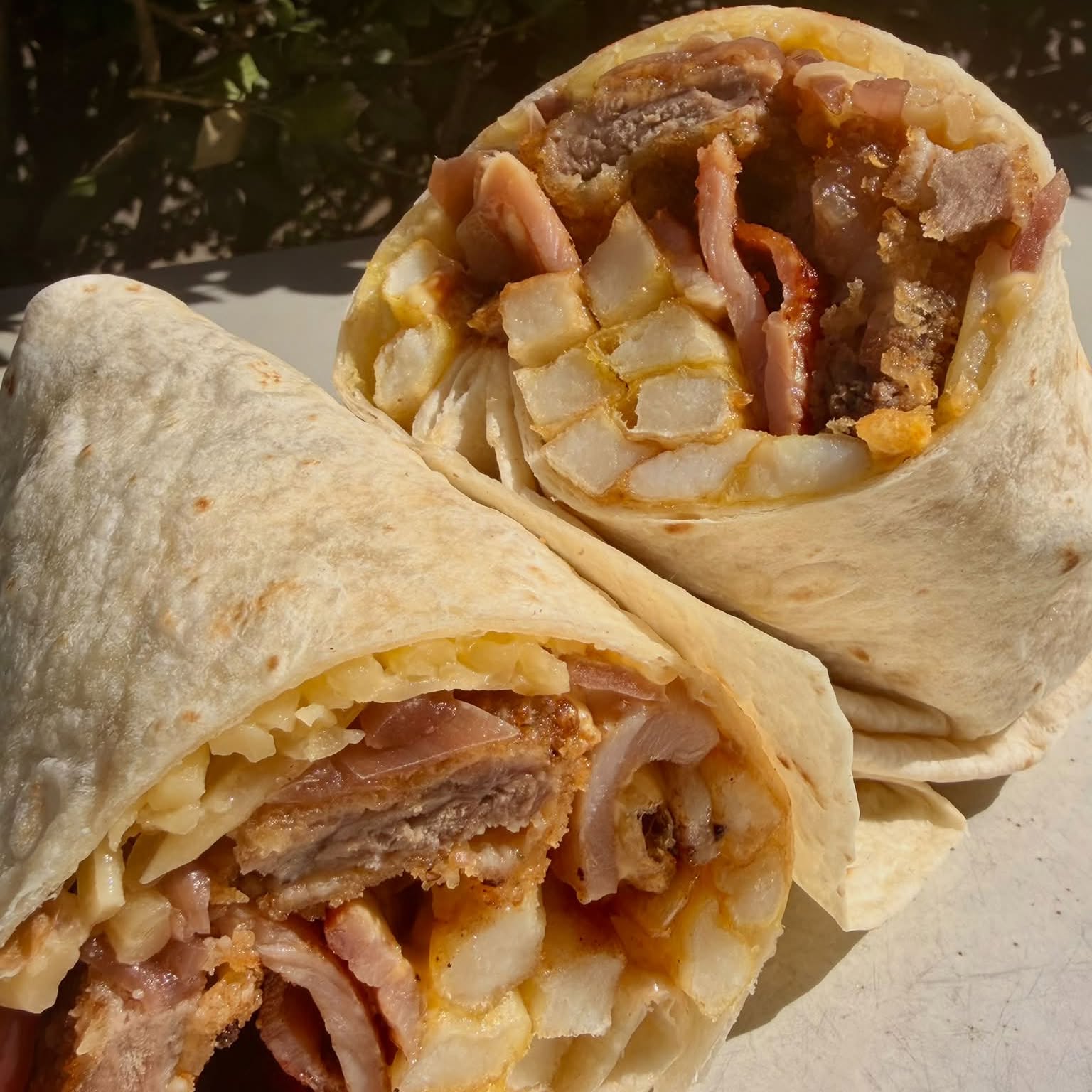 Schnitzel, bacon and chips wrap