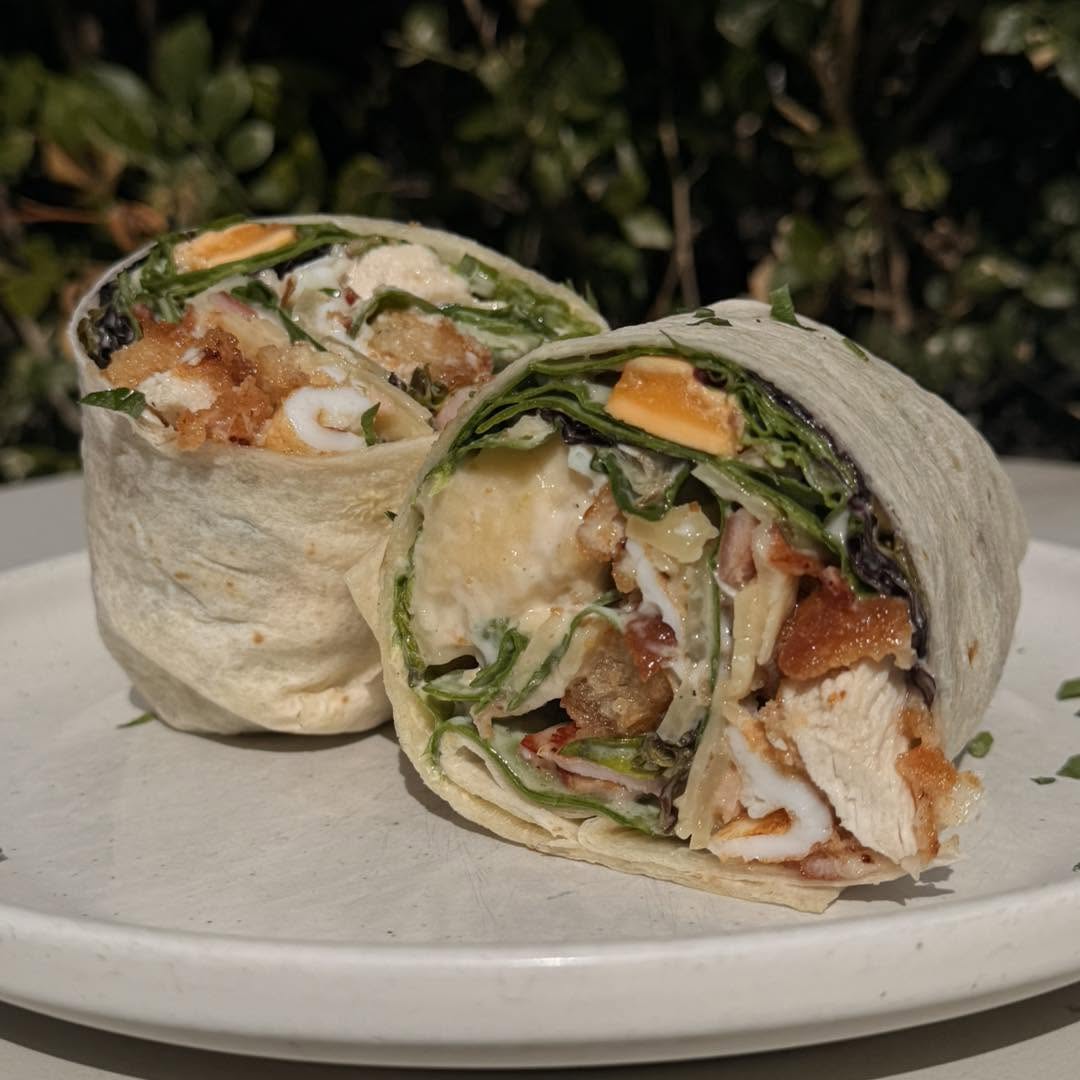 Chicken caesar wrap on a white plate