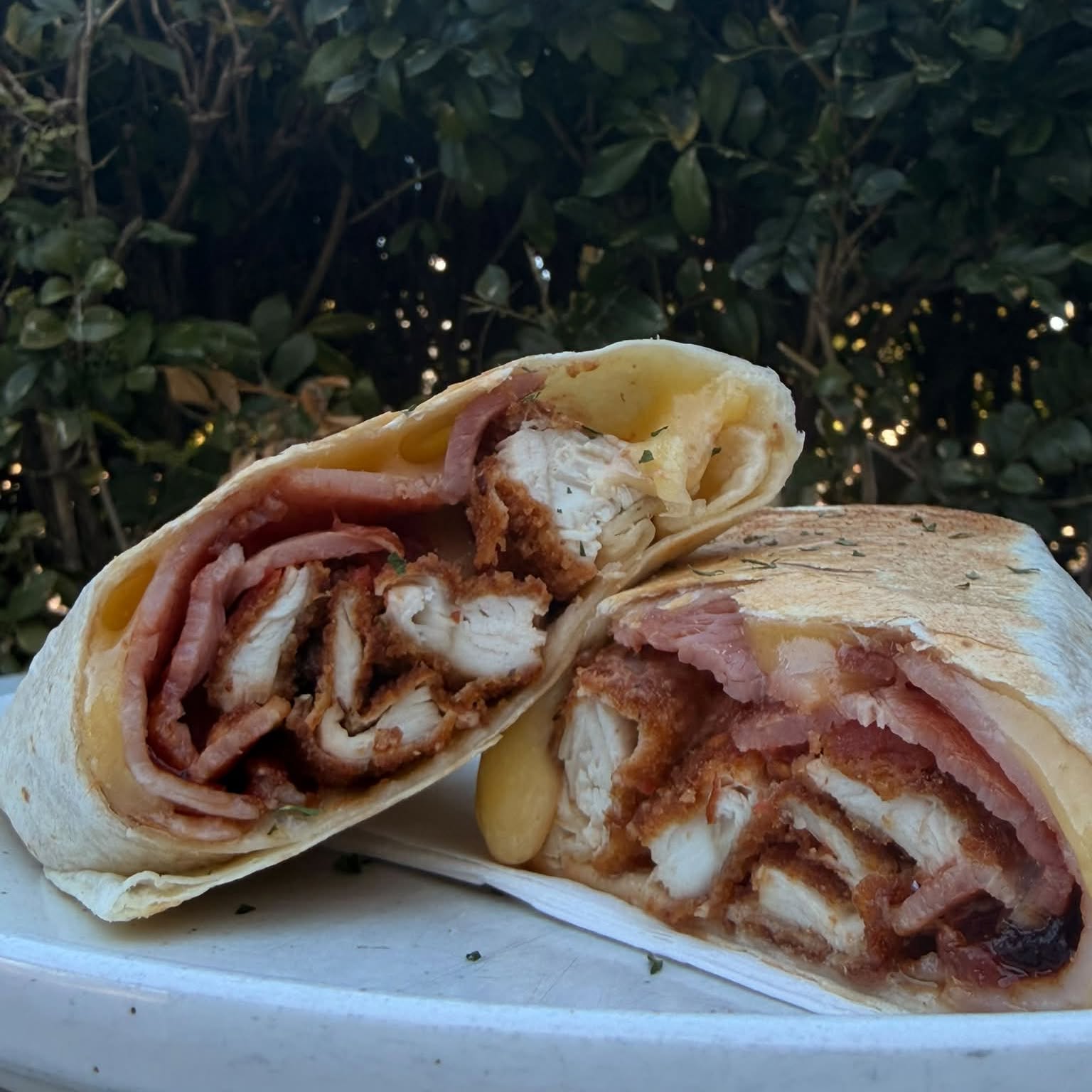 Schnitzel, bacon and ham wrap