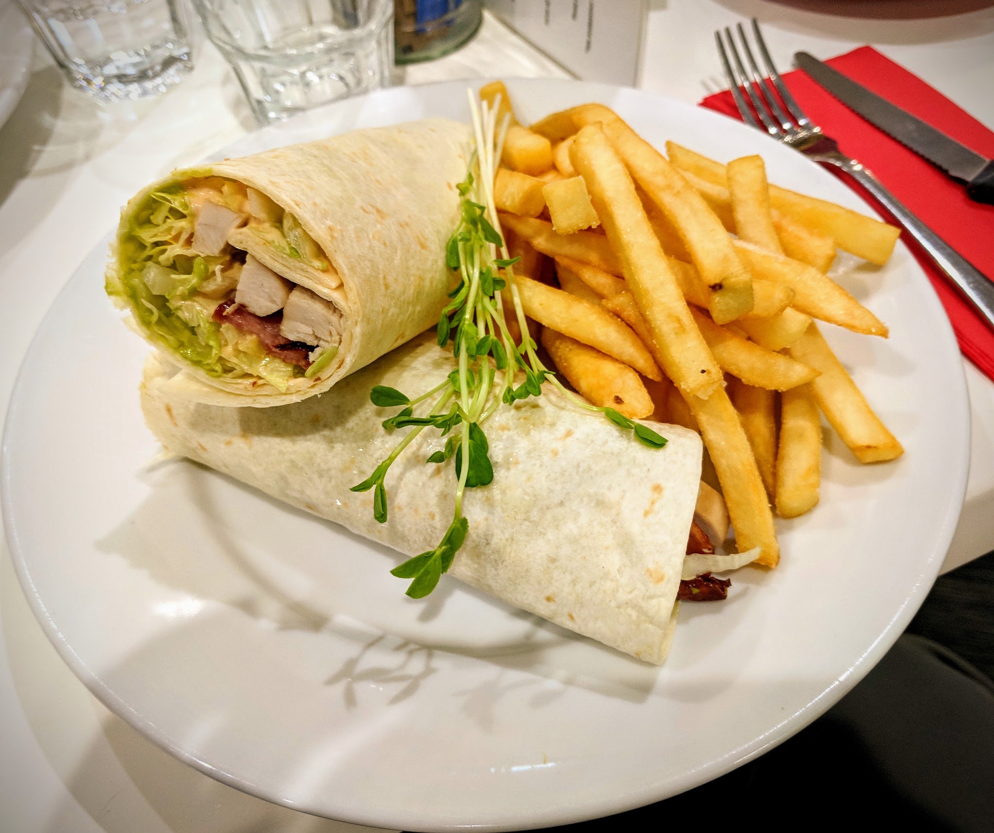 Chicken wrap served with chips