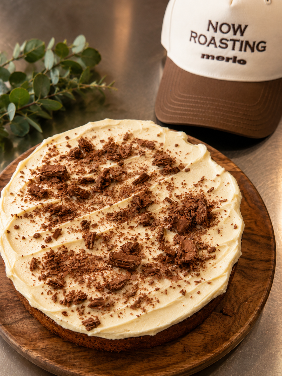 A homemade chocolate topped cream cake at T-Table
