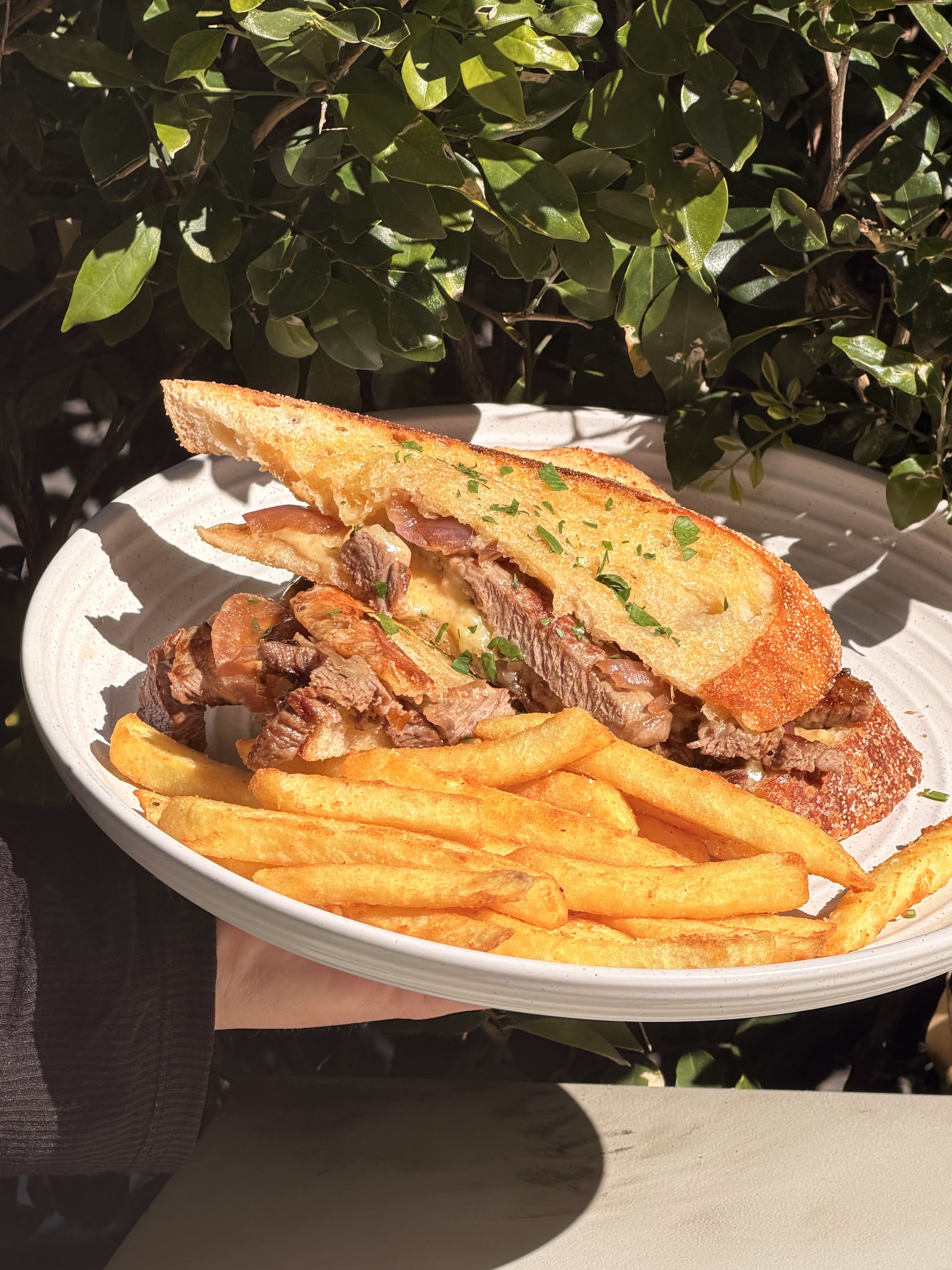 Steak sandwich with chips at T-Table Cafe