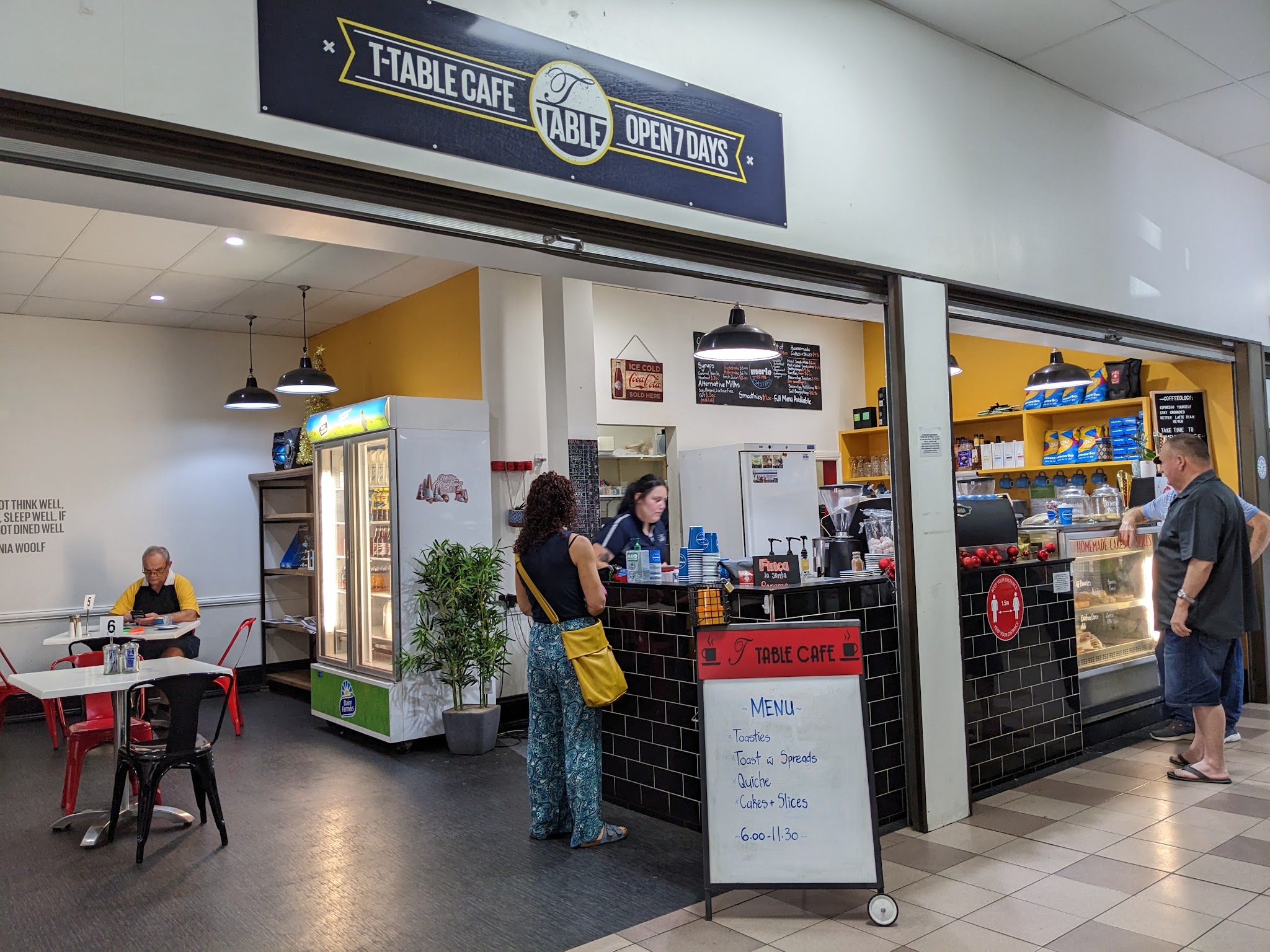 The T-Table Cafe sign above the shopfront in the arcade